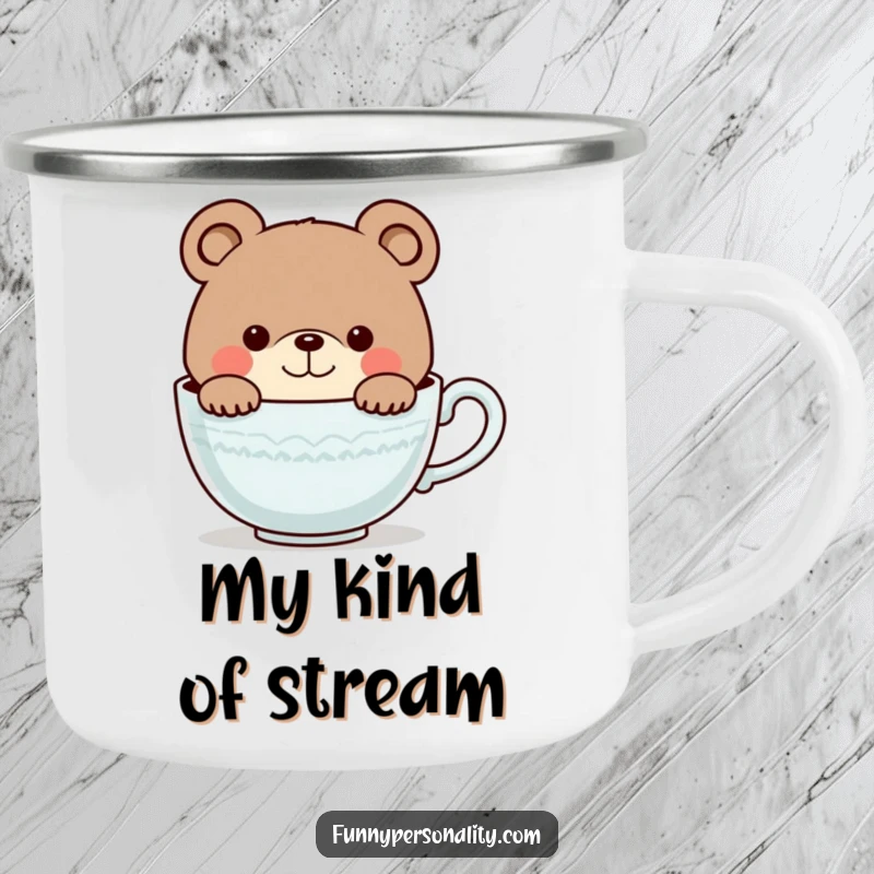 Funny camping mug showcasing a curious bear character smiling as it peeks into a giant teacup, ideal for outdoor drinks.