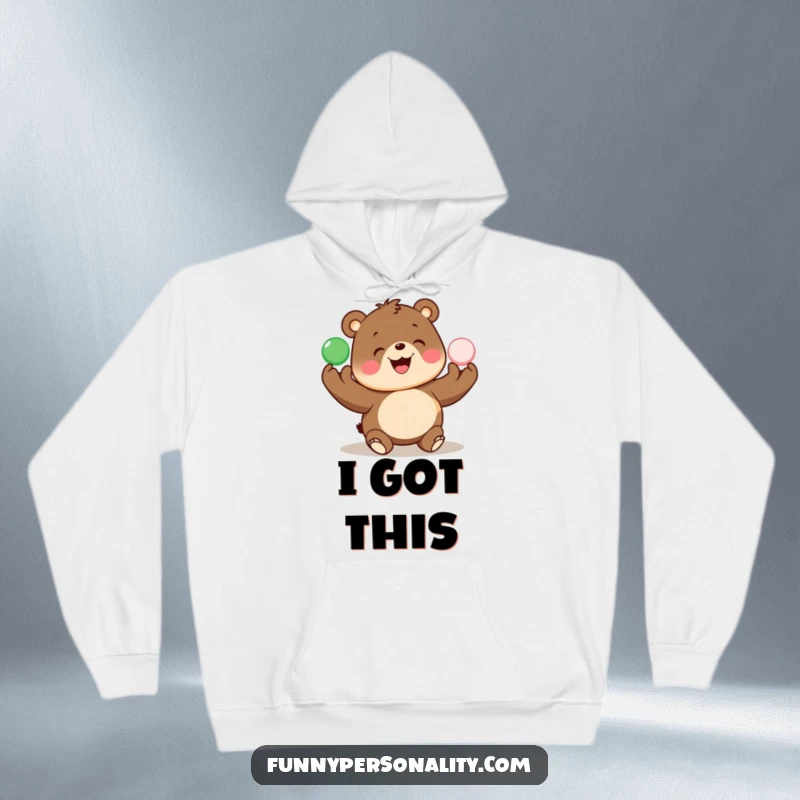 Funny hoodie features a cheerful bear enthusiastically juggling colorful balls, offering warmth and humor.