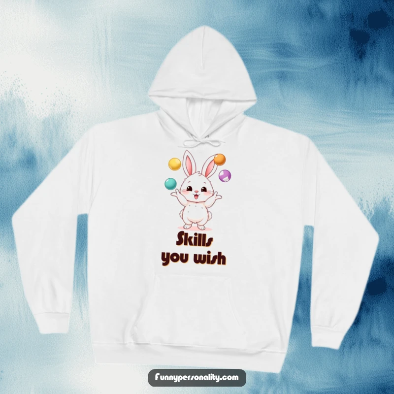 Funny hoodie showcasing a fluffy bunny character skillfully juggling three colorful balls, perfect for staying warm and amused.