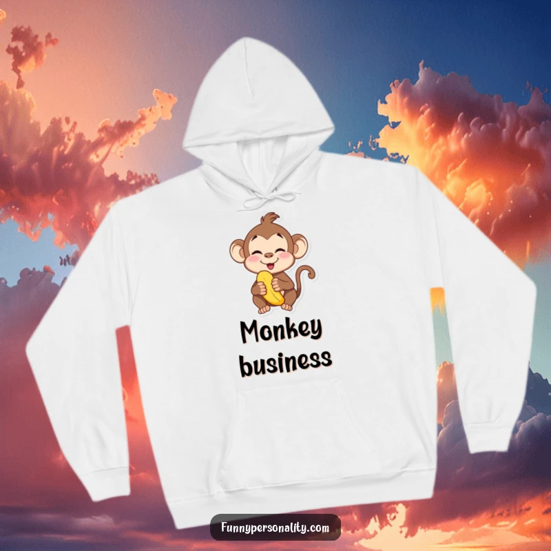 Funny hoodie print of a playful monkey making a silly face while munching on a banana. Cozy and comical.